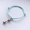 Fit Kolekcja - Bransoletka ze sznurka z hantlem pastel mint