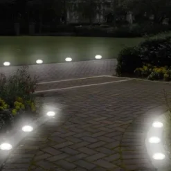 LAMPA SOLARNA OGRODOWA LAMPKI LED GRUNTOWE DYSK CZUJNIK ZMIERZCHU 12 DYSKÓW